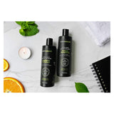 Bottles of Prairie Naturals Men's Active Sport Daily Shampoo & Conditioner Lifestyle